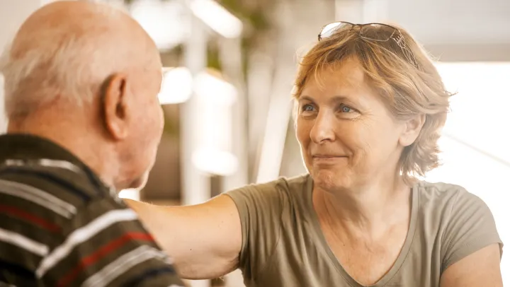 man and woman looking at each other